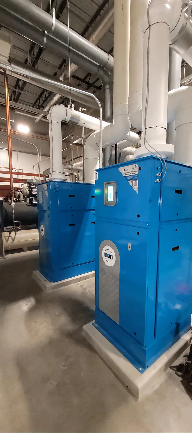 Commercial blue boiler plant and insulated piping at a ZMS work site